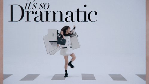 A Woman Holding Shopping Bags With The Words " It 'S So Dramatic " On The Bottom GIF