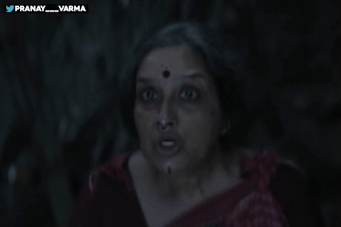 A Woman Holds Her Finger To Her Lips With The Words Pranay_varma Behind Her GIF