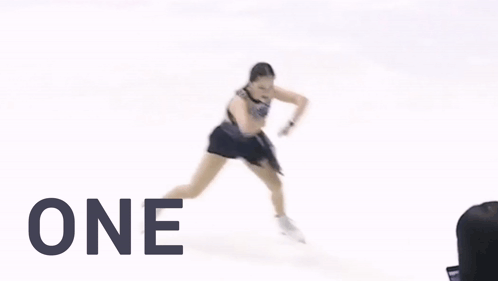 A Woman Ice Skating With The Words Slay One Must Above Her GIF