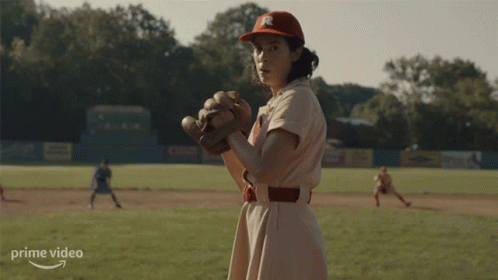 Woman In Baseball Uniform Standing On Field GIF