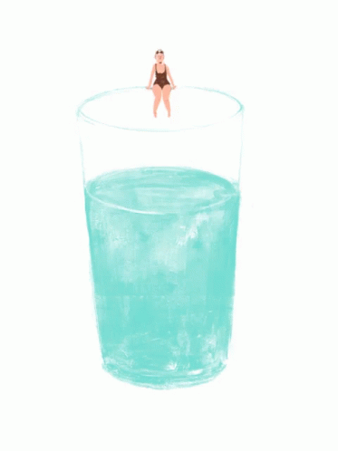 A Woman In A Bathing Suit Sits On The Edge Of A Glass Of Water GIF