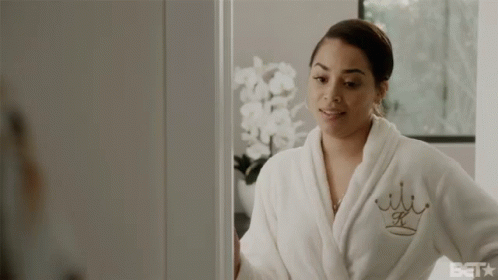 A Woman In A Bathrobe Is Smiling And Says Handle That Thing Yourself GIF