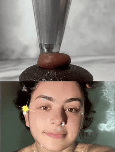 a woman in a bathtub with a glass on her head and a rock on her head