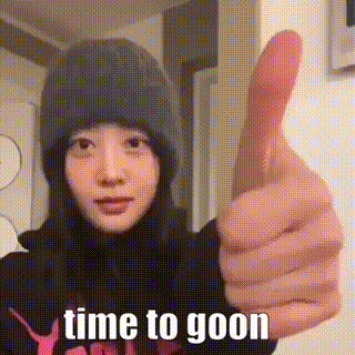 A Woman In A Beanie Is Giving A Thumbs Up . GIF