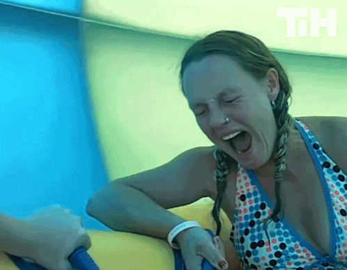A Woman In A Bikini Is Screaming While Riding A Water Slide With The Letters Th Visible In The Background GIF