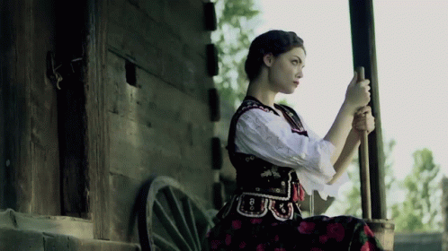 A Woman In A Black And White Dress Has The Number 8 On Her Waist GIF