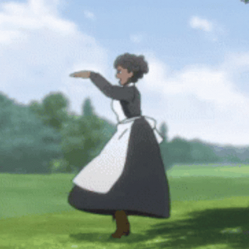 A Woman In A Black And White Dress Is Dancing In A Field GIF