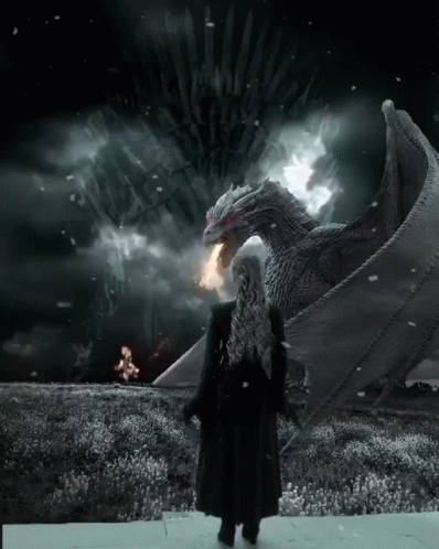 A Woman In A Black Coat Stands In Front Of A Large Dragon With A Throne In The Background GIF