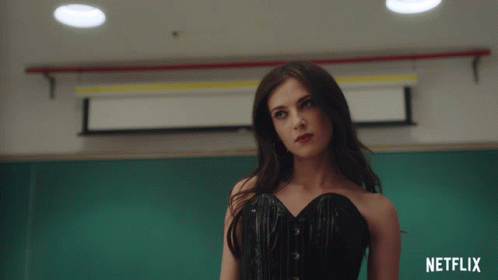 Woman In Black Corset In Front Of Netflix Sign GIF