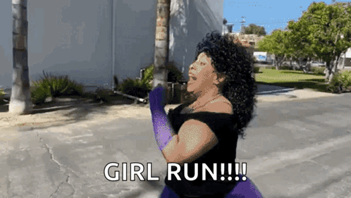 A Woman In A Black Dress And Purple Gloves Is Saying Girl Run GIF