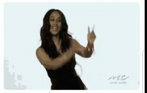 a woman in a black dress is dancing with her arms outstretched