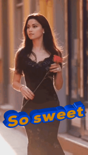 A Woman In A Black Dress Is Holding A Red Rose And The Word So Sweet Is Above Her GIF