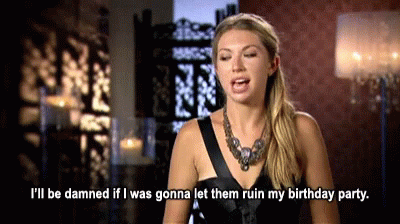 A Woman In A Black Dress Is Saying I 'Ll Be Damned If I Was Gonna Let Them Ruin My Birthday Party GIF
