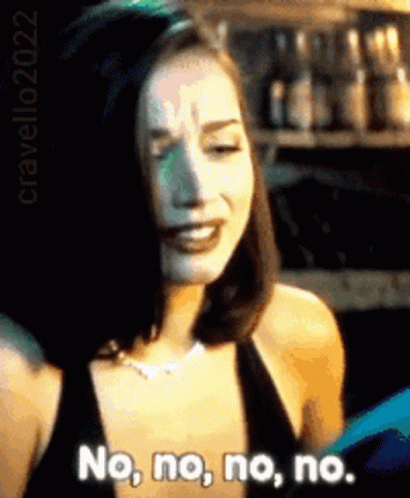 A Woman In A Black Dress Is Saying No No No No . GIF