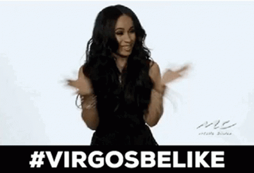 A Woman In A Black Dress Is Sticking Her Tongue Out While Dancing . GIF