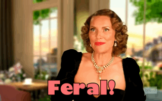 A Woman In A Black Dress Says Feral In Pink Letters GIF