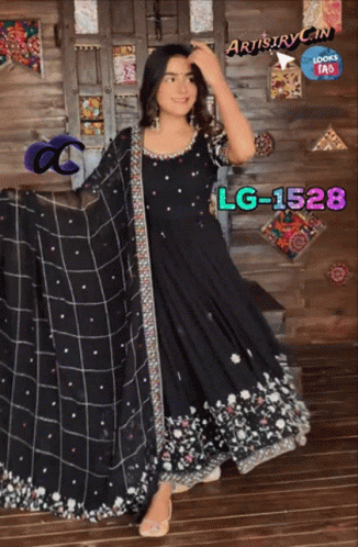 A Woman In A Black Dress With Lg-1528 Written On The Bottom GIF