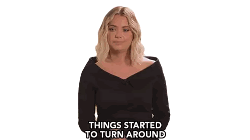 a woman in a black dress with the words things started to turn around above her