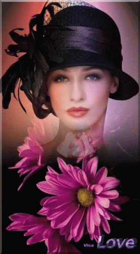 A Woman In A Black Hat Is Surrounded By Purple Flowers And The Word Love Is On The Bottom GIF