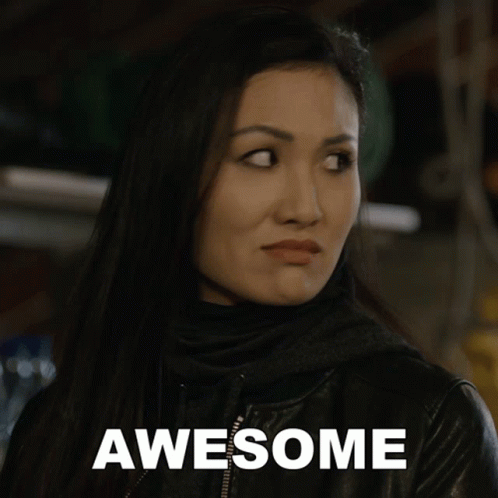 A Woman In A Black Jacket With The Word Awesome Written On It GIF