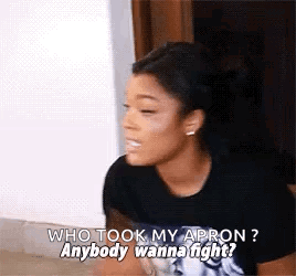 A Woman In A Black Shirt Is Talking To Another Woman . GIF
