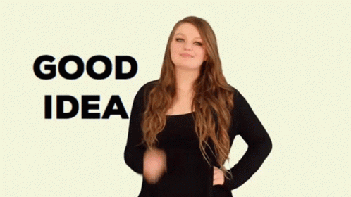 A Woman In A Black Shirt Says Good Idea In Sign Language GIF