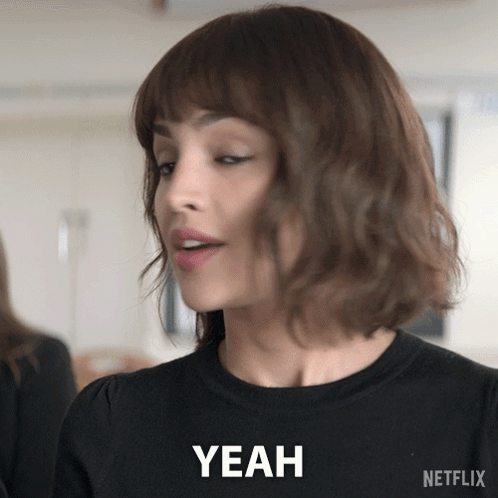 A Woman In A Black Shirt Says Yeah In A Netflix Ad GIF
