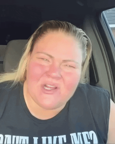 A Woman In A Black Shirt That Says I Turn Me GIF