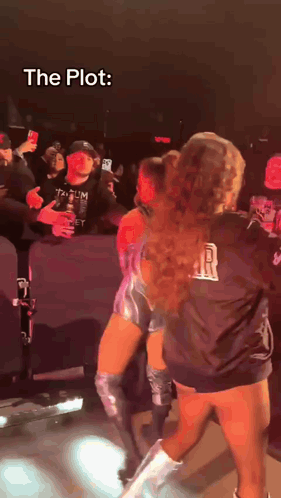 a woman in a black shirt that says r on it