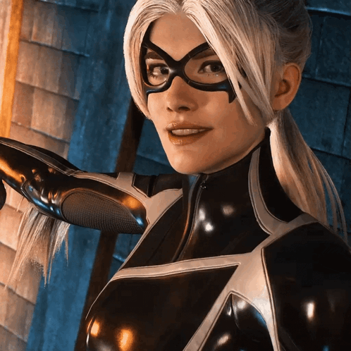 A Woman In A Black Superhero Costume With Glasses GIF