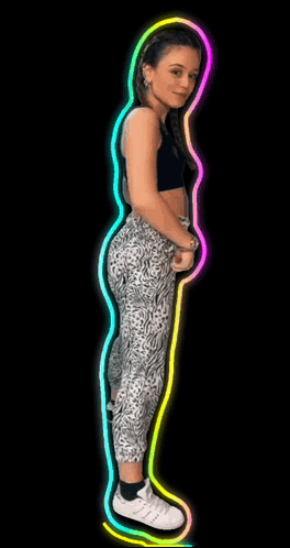 A Woman In A Black Top And Leopard Print Leggings Dancing GIF