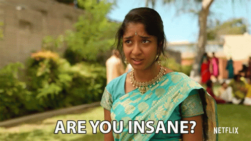 A Woman In A Blue And Gold Sari Is Asking Are You Insane ? GIF