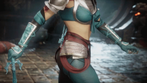 A Woman In A Blue And Silver Armored Outfit Holds A Sword GIF