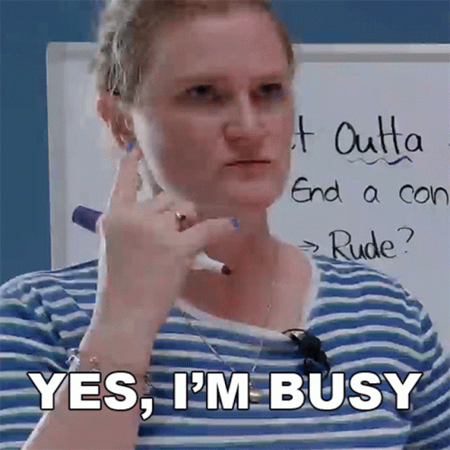 A Woman In A Blue And White Striped Shirt Says Yes I 'M Busy GIF