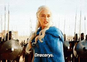 A Woman In A Blue Cape Says Dracarys In Front Of A Row Of Soldiers GIF