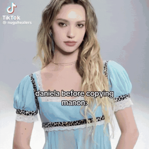 A Woman In A Blue Dress Has A Tiktok Video Of Daniela Before Copying Manon GIF