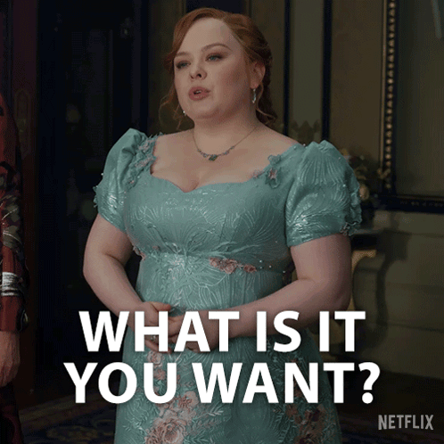 A Woman In A Blue Dress Is Asking " What Is It You Want " GIF