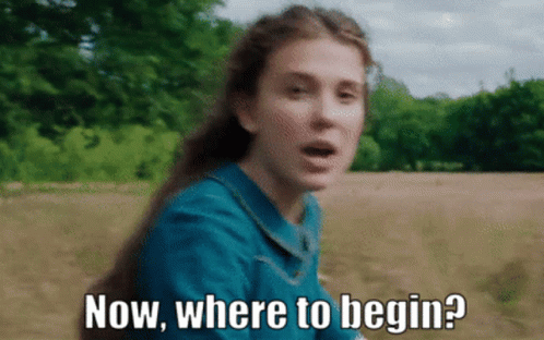 A Woman In A Blue Dress Is Asking Where To Begin GIF