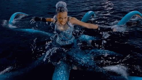 A Woman In A Blue Dress Is In The Water With The Words True Love 'S Kiss Won 'T Defeat This GIF