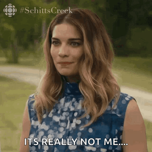 A Woman In A Blue Dress Is Saying It 'S Really Not Me ... GIF