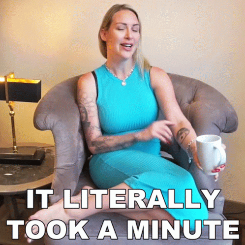 a woman in a blue dress is sitting in a chair holding a cup of coffee and says it literally