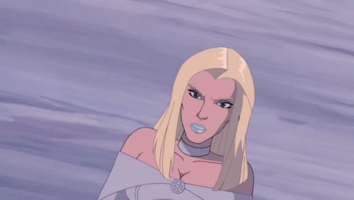 A Woman In A Blue Dress Is Standing In Front Of A Cloudy Sky GIF