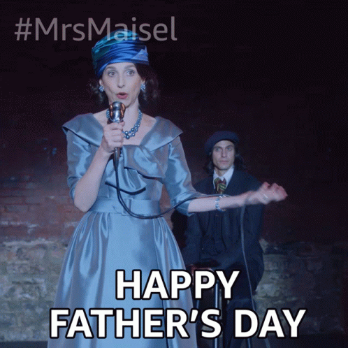 A Woman In A Blue Dress Singing Into A Microphone With The Words Happy Father 'S Day Below Her GIF