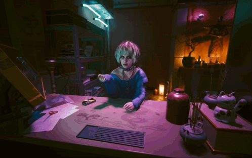 A Woman In A Blue Dress Sits At A Table With A Purple Background GIF