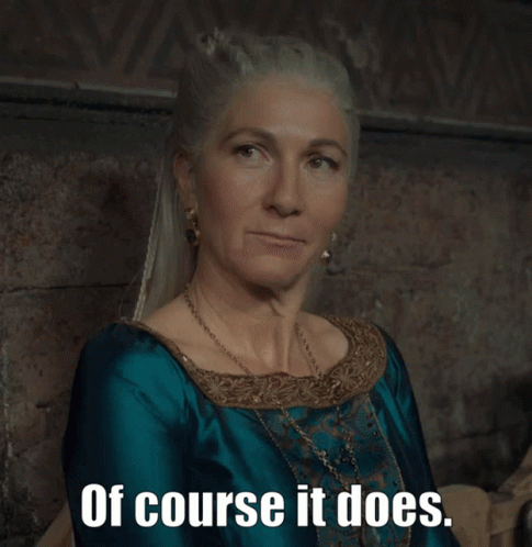 A Woman In A Blue Dress With The Words Of Course It Does Written Below Her GIF