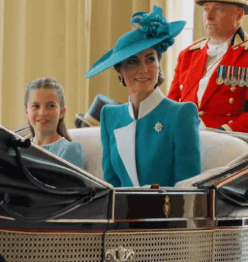 A Woman In A Blue Hat Is Sitting In A Car With A Little Girl GIF