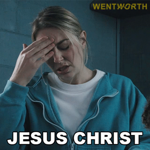 A Woman In A Blue Jacket Covering Her Face With Her Hand And The Words Jesus Christ Written Below Her GIF