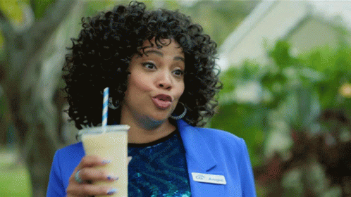 A Woman In A Blue Jacket Has A Name Tag That Says Angie GIF