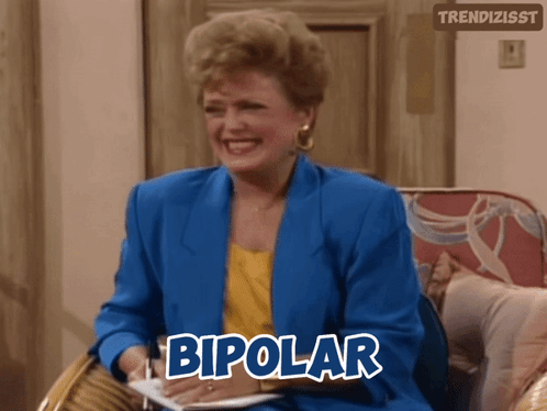 A Woman In A Blue Jacket Is Sitting In A Chair With The Word Bipolar Above Her GIF