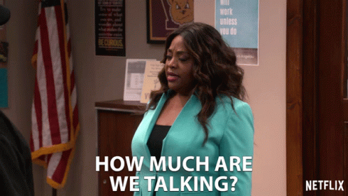 A Woman In A Blue Jacket Says How Much Are We Talking On Netflix GIF